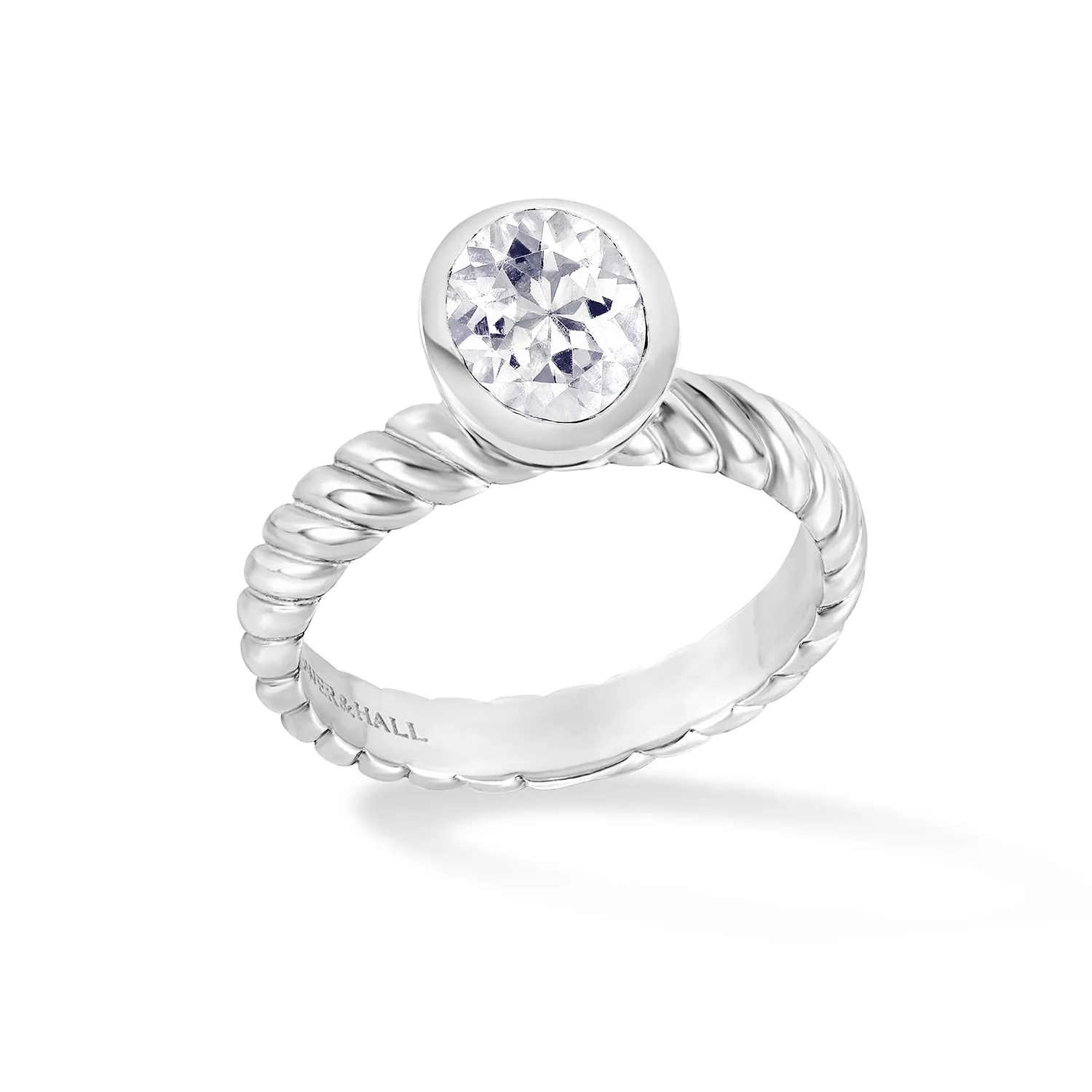 Oval White Topaz Twist Twinkle Ring sold by Dower & Hall