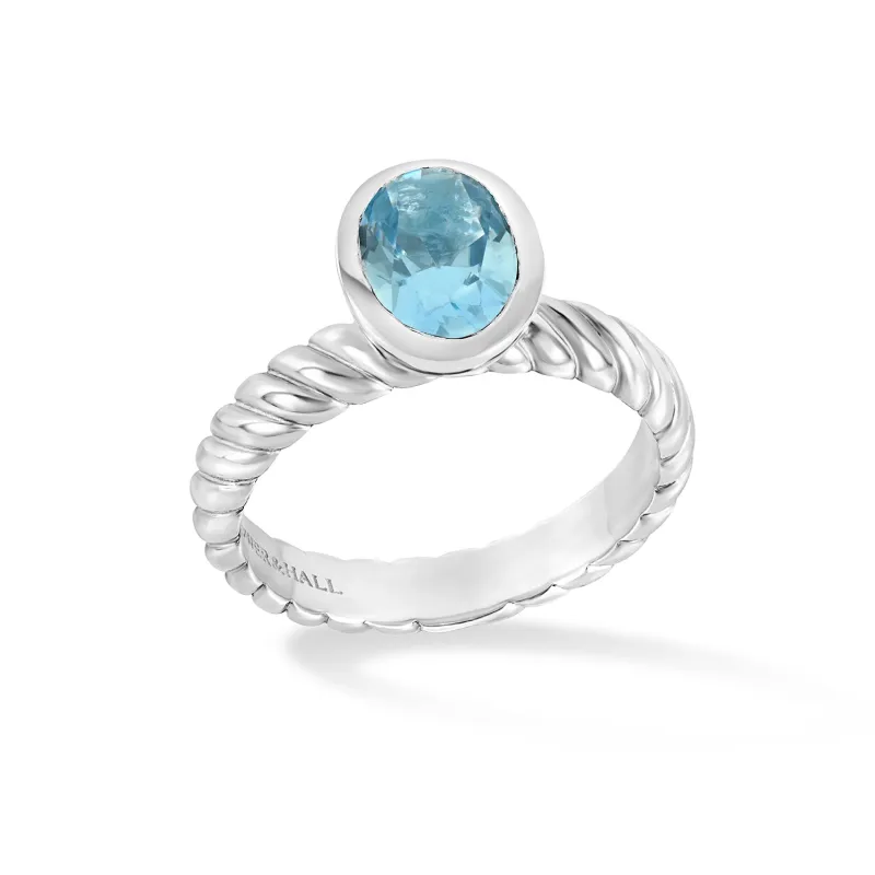 Oval Blue Topaz Twist Twinkle Ring sold by Dower & Hall