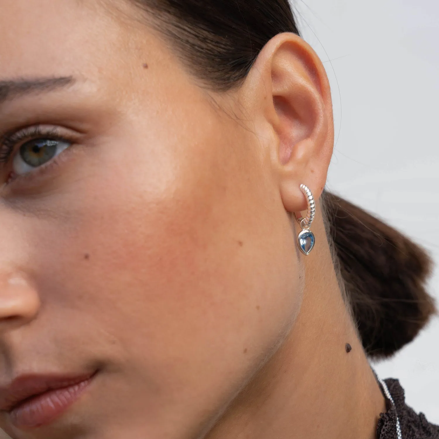 Blue Topaz Twist Huggie Charm Hoops sold by Dower & Hall product image thumbnail 3