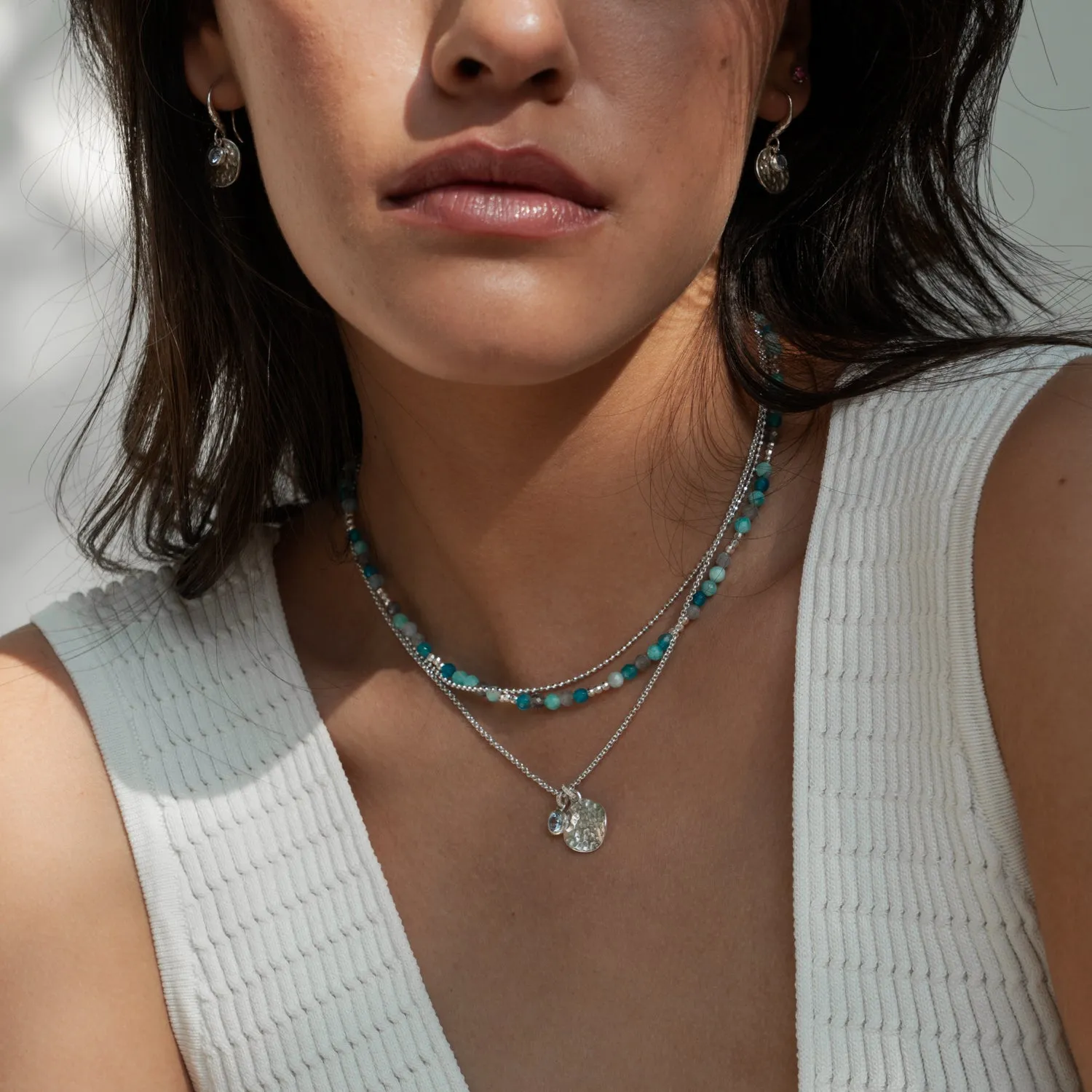 Hammered Disc & 5mm Blue Topaz Array Pendant sold by Dower & Hall product image thumbnail 2