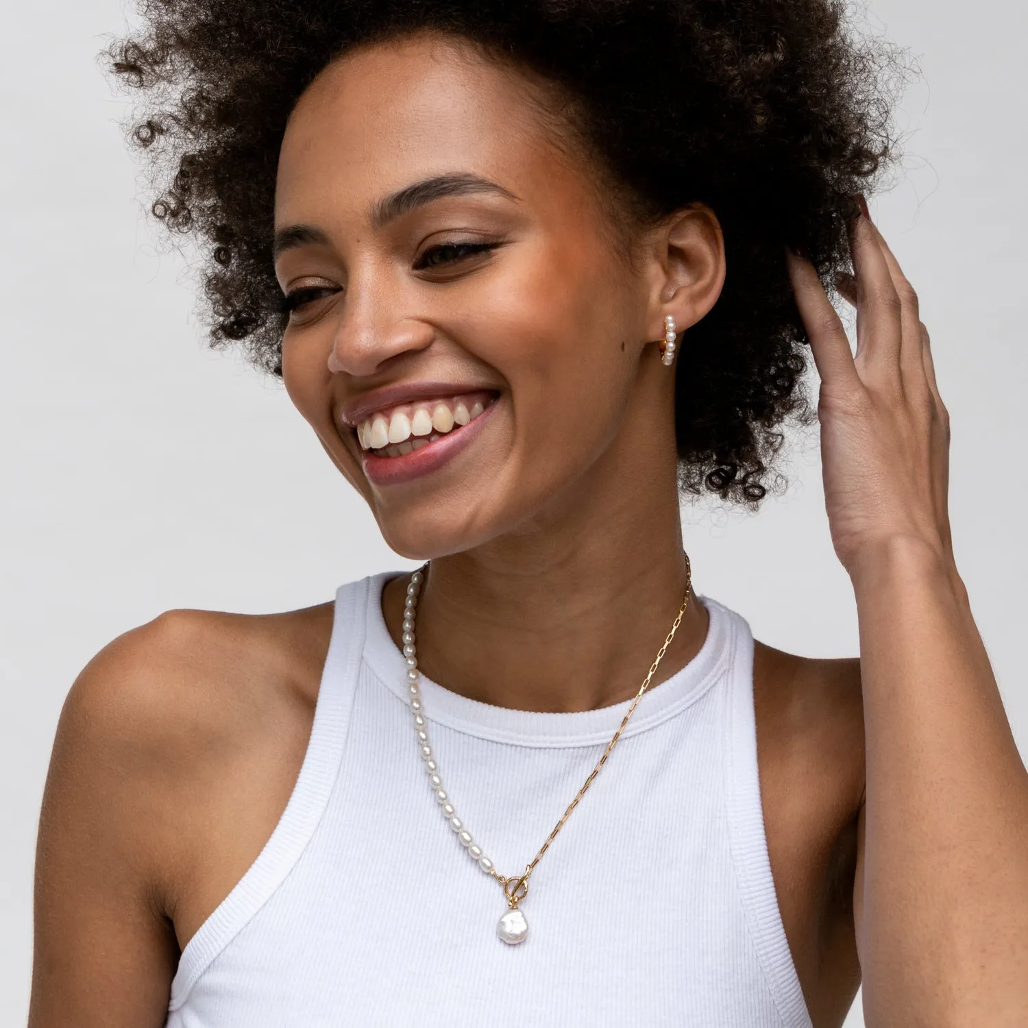 Medium Timeless Pearl Huggie Hoops sold by Dower & Hall product image thumbnail 2