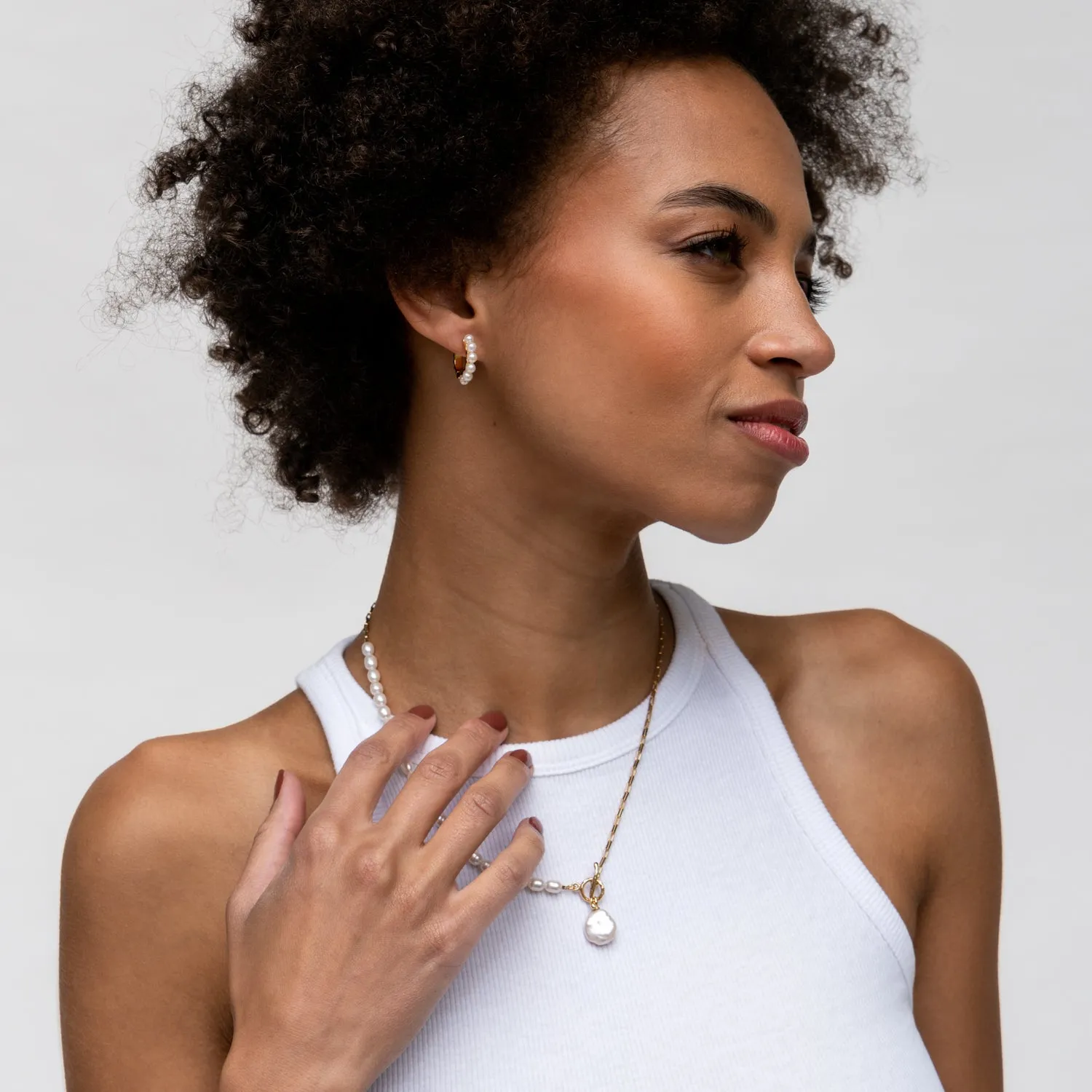 Medium Timeless Pearl Huggie Hoops sold by Dower & Hall product image thumbnail 3