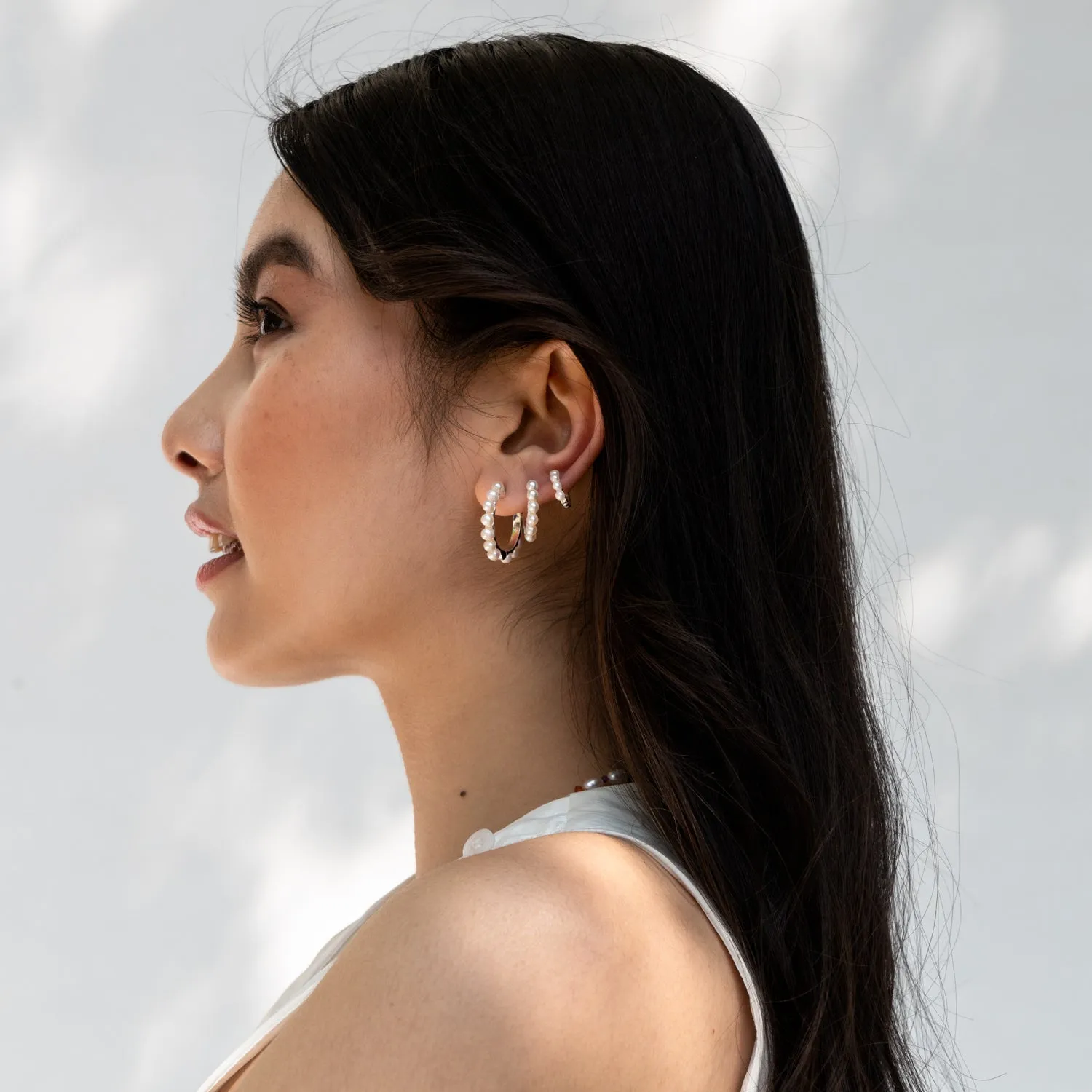 Small Timeless Pearl Huggie Hoops sold by Dower & Hall product image thumbnail 4