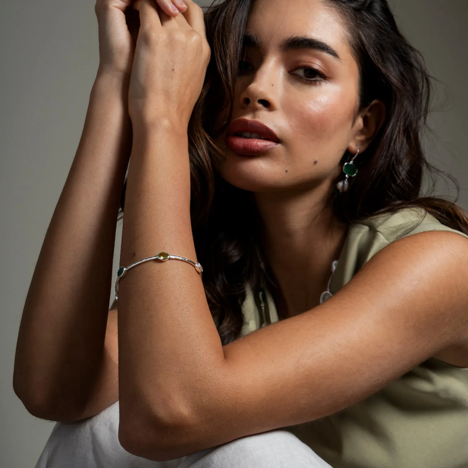 Oval Green Garnet, Peridot & Topaz Array Bangle sold by Dower & Hall product image thumbnail 2