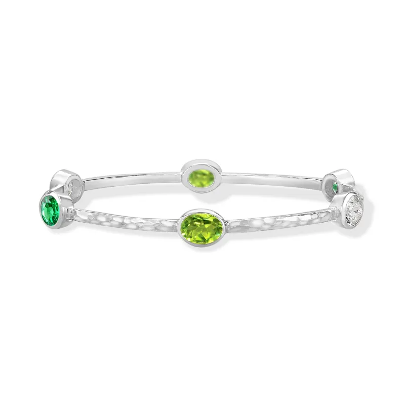 Oval Green Garnet, Peridot & Topaz Array Bangle sold by Dower & Hall