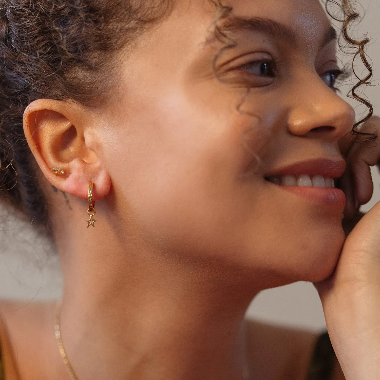 Hammered Star Charm Huggie Hoops sold by Dower & Hall product image thumbnail 5