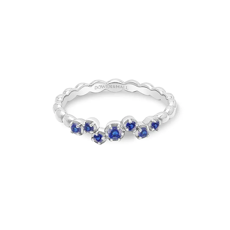 14k Stargazer Narrative Ring with Blue Sapphire sold by Dower & Hall