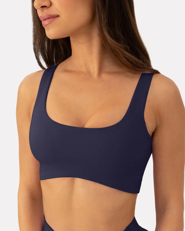 Athleisure Curved Hem Medium-Support Sports Bra sold by PAVOI