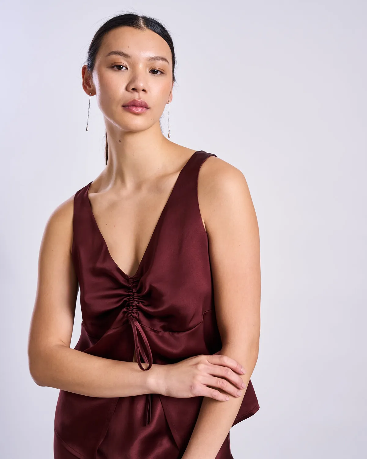 RUFFLED V-NECK TOP TALARA INTENSE RUST sold by JAN 'N JUNE