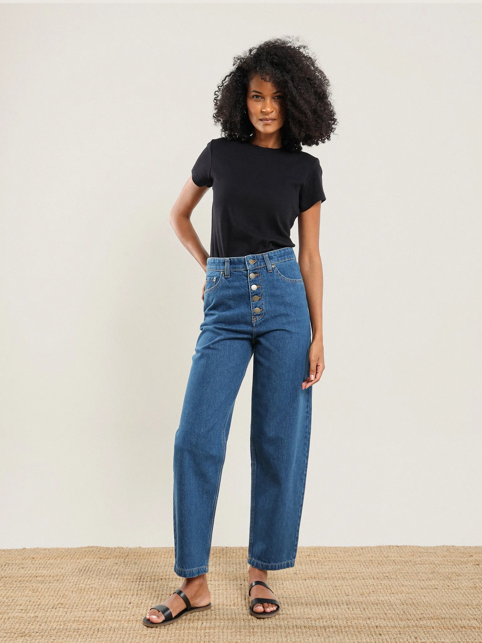 Curved Button Fly Jean sold by Nazeerah