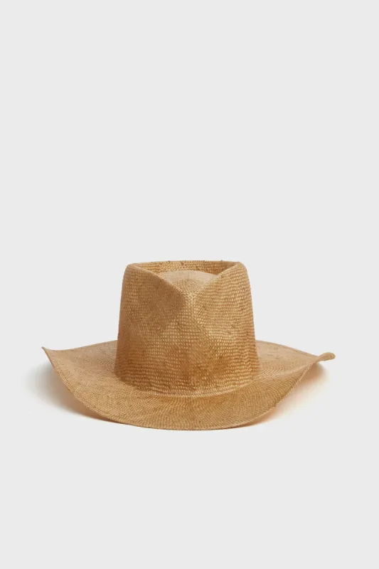 The Oasis Gold Brown Hat sold by Tuckernuck