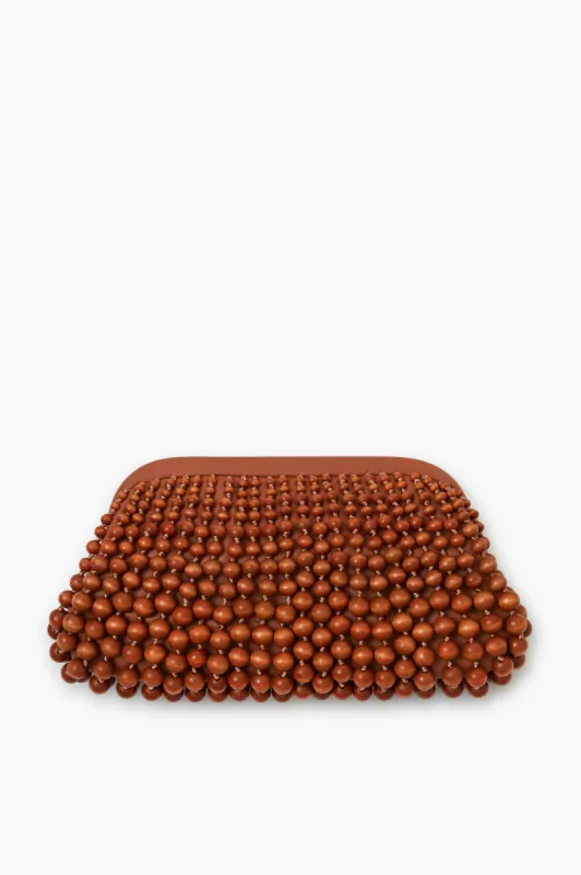 Chestnut Nia Clutch sold by Tuckernuck