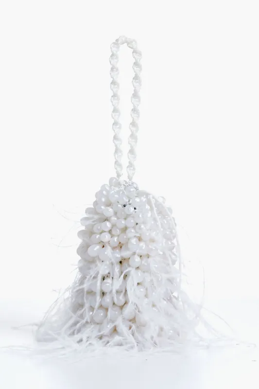 Pearl Dora Feather Wristlet sold by Tuckernuck