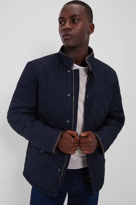 Navy Powell Quilt sold by Tuckernuck