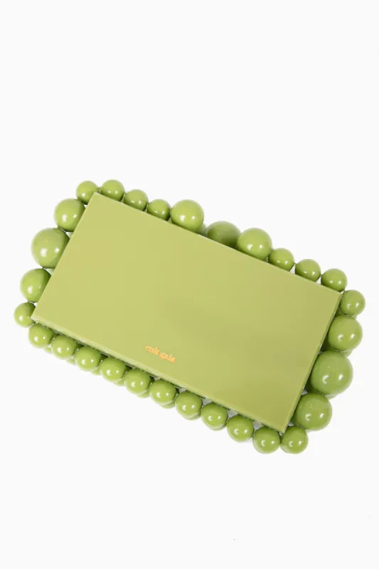 Palm Eos Clutch sold by Tuckernuck