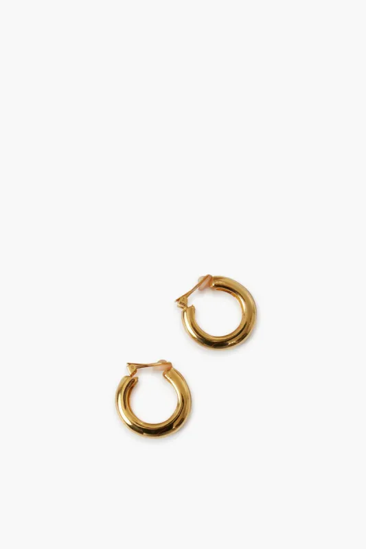 Polished Gold Clip On Hoops sold by Tuckernuck