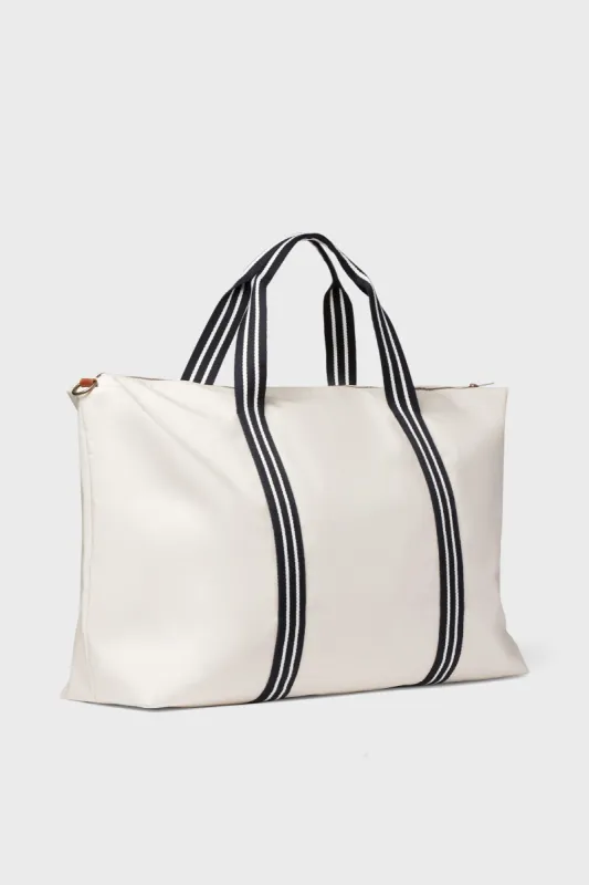 White and Navy Coated Canvas Weekender sold by Tuckernuck