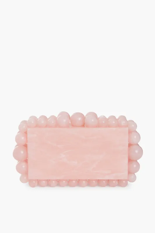 Pink Eos Clutch sold by Tuckernuck