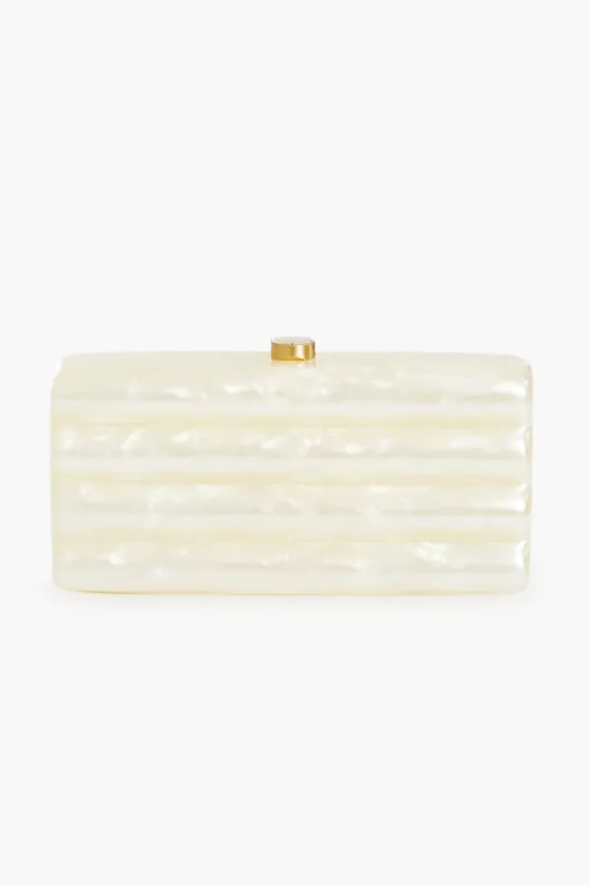 Ivory Enid Clutch sold by Tuckernuck
