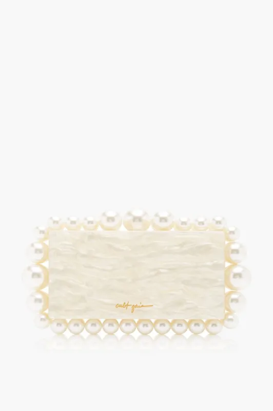 Ivory Eos Clutch sold by Tuckernuck