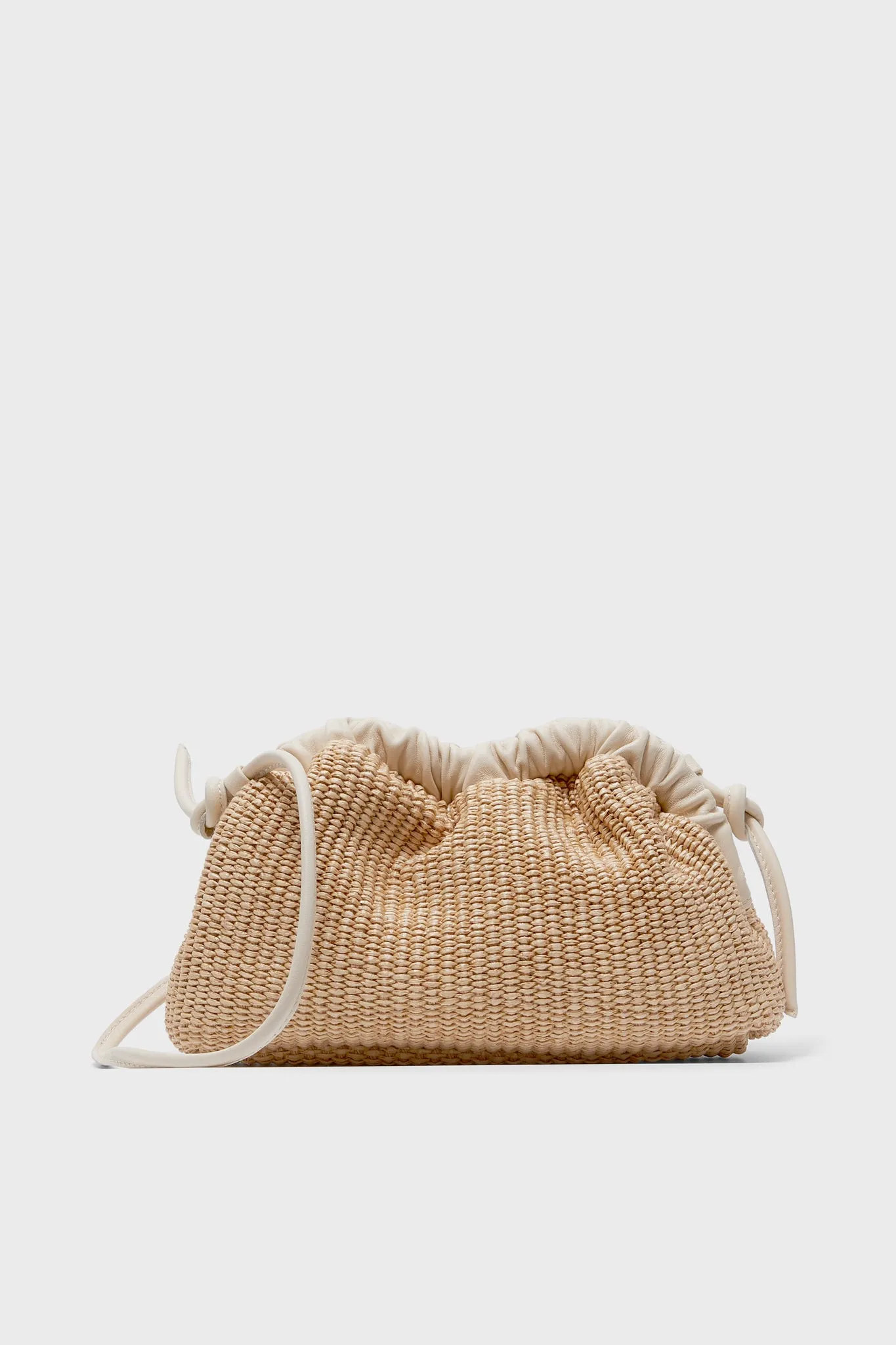 Natural and Jasmine Mini Cloud Clutch sold by Tuckernuck