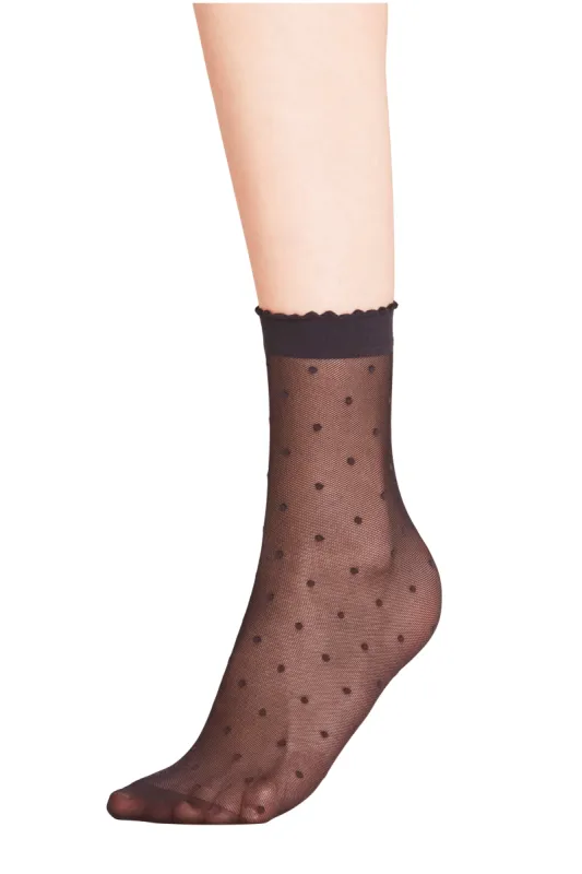 Black Sheer Polka Dot Socks sold by Tuckernuck