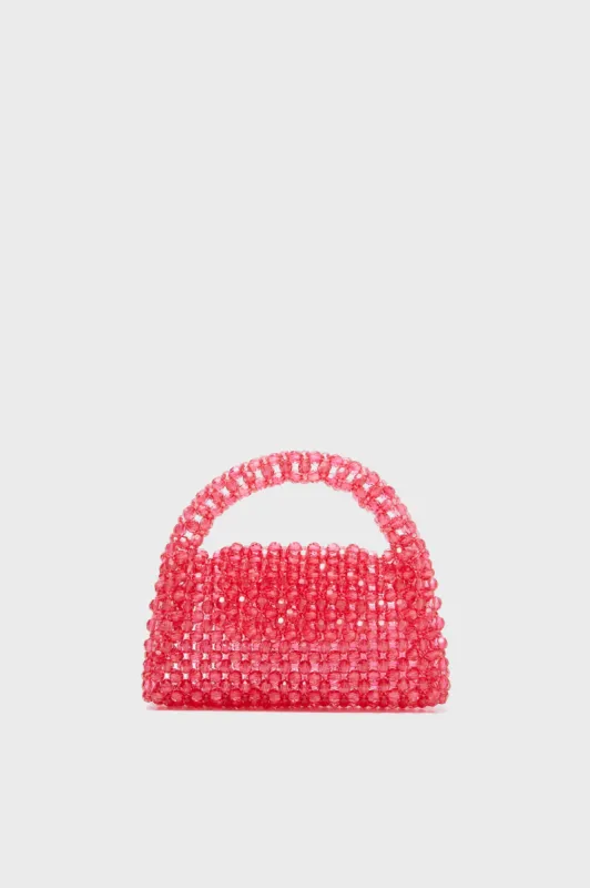 Fuchsia Dolly Bag sold by Tuckernuck