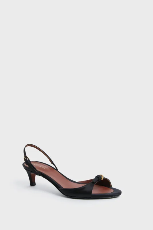 Black Crepe Satin Capricciosa Heels sold by Tuckernuck