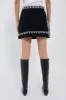 Black Mille Embroidery Mini Skirt sold by Tuckernuck