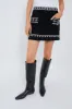 Black Mille Embroidery Mini Skirt sold by Tuckernuck