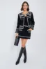 Black Mille Embroidery Mini Skirt sold by Tuckernuck