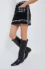 Black Mille Embroidery Mini Skirt sold by Tuckernuck