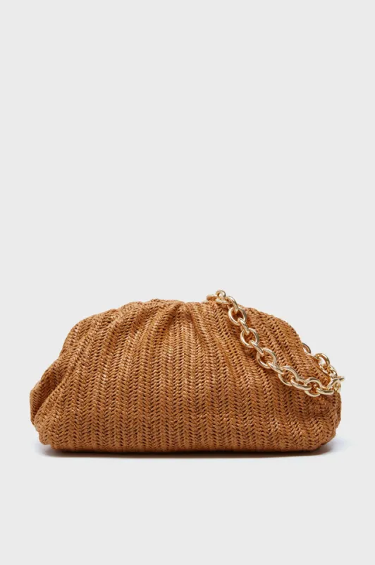 Dark Raffia Slouchy Clutch sold by Tuckernuck