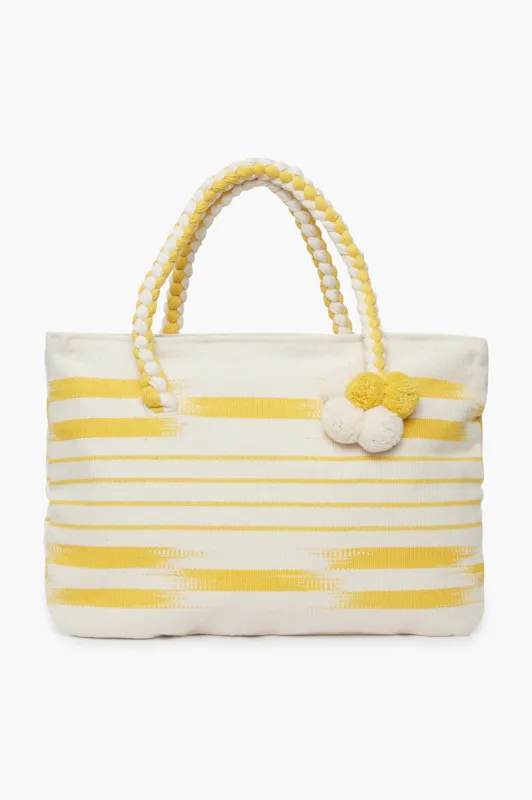 Yellow Woven Pom Pom Tote sold by Tuckernuck