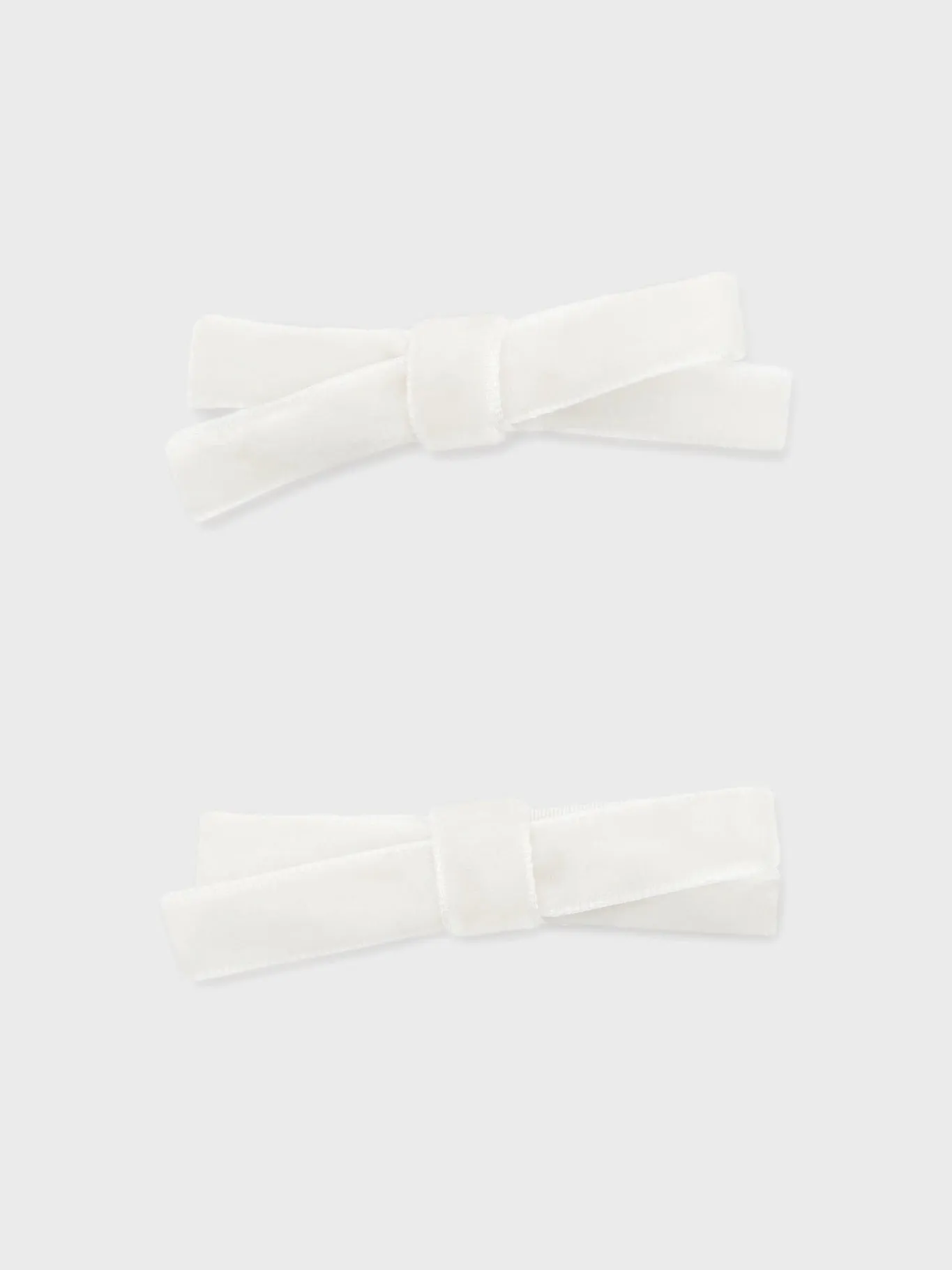White Small Velvet Bow Clips Set of 2 sold by Tuckernuck