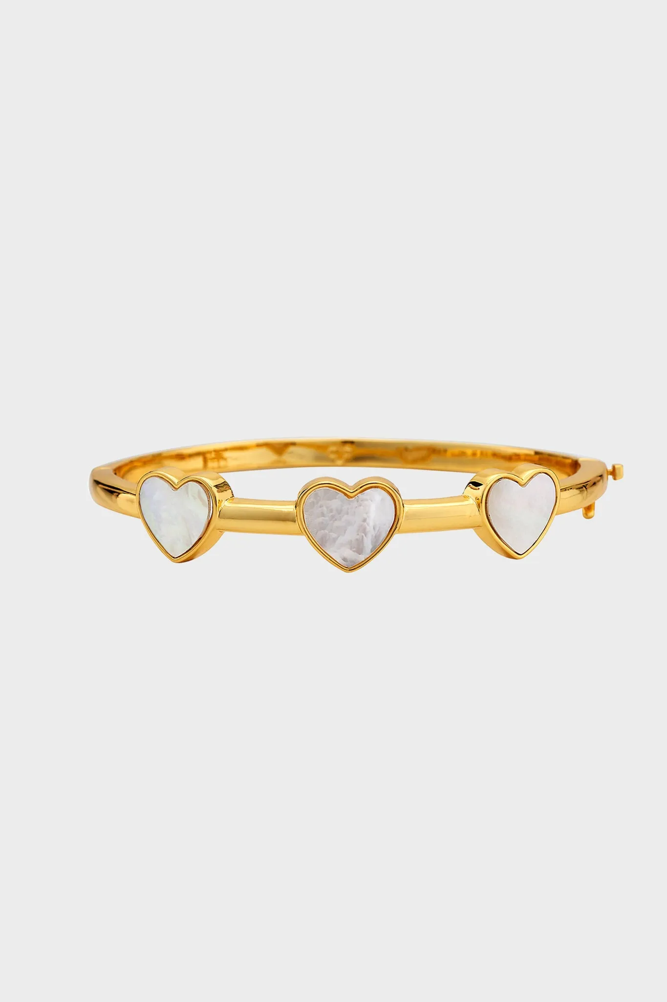 Gold Heart Bangle sold by Tuckernuck