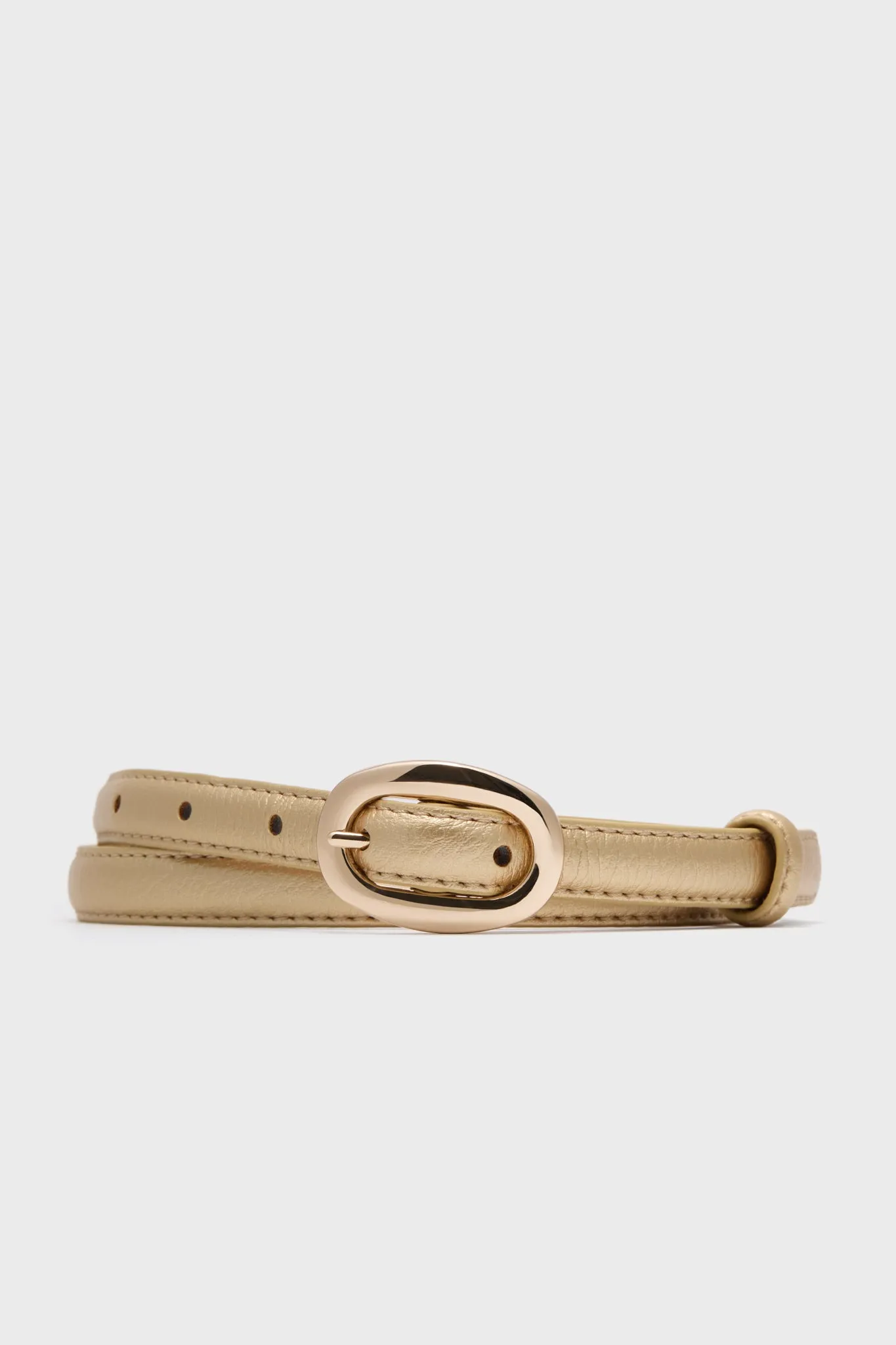 Pebbled Gold Oval Buckle Skinny Belt sold by Tuckernuck