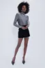 Black Velvet Opal Mini Skirt sold by Tuckernuck