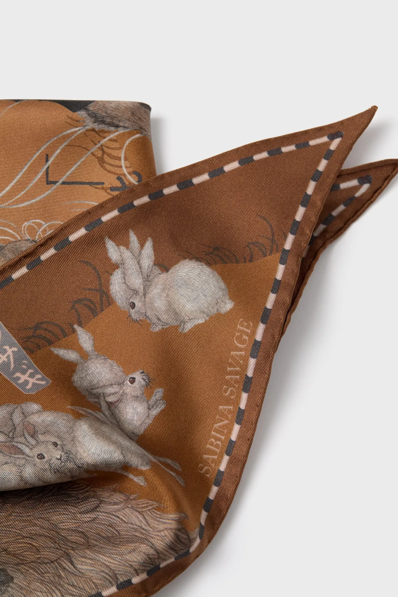 The Floating Rabbits Cinnamon Triangle Scarf sold by Tuckernuck product image thumbnail 5