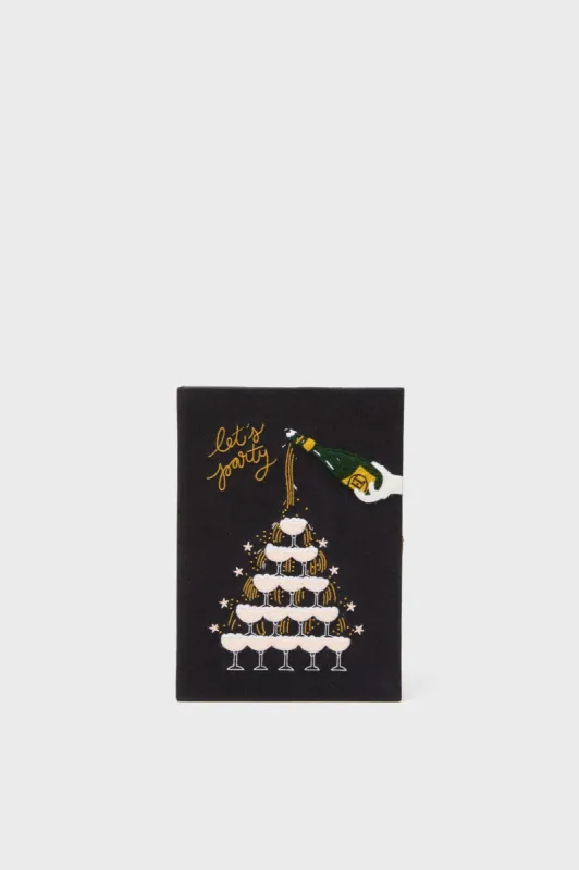 Let's Party Book Clutch sold by Tuckernuck