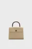CHANEL Canvas Top Handle Bag sold by Tuckernuck
