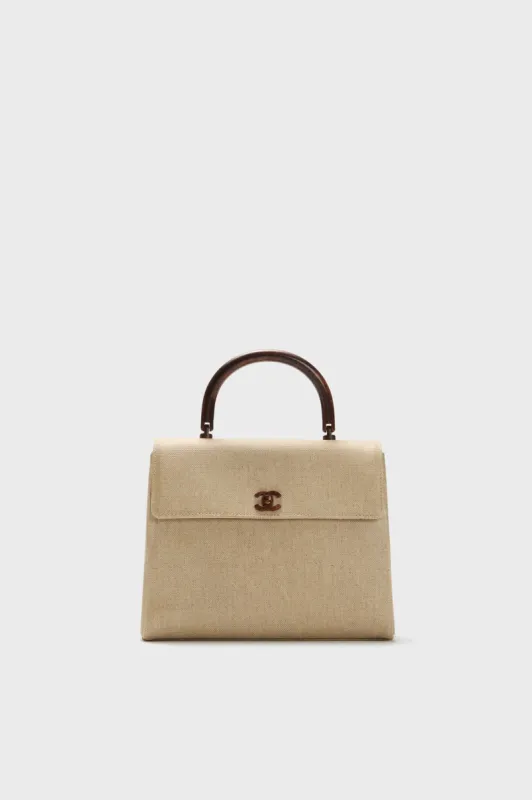 CHANEL Canvas Top Handle Bag sold by Tuckernuck
