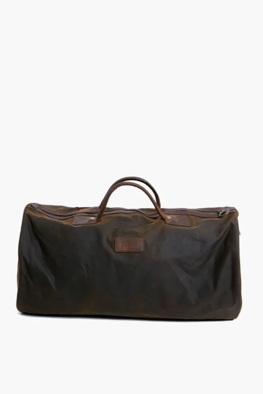 Olive Wax Holdall sold by Tuckernuck
