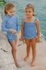 Blue Floral Smocked One Piece with Ruffle Skirt sold by Tuckernuck
