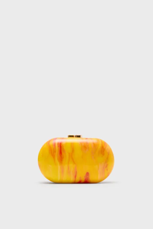 Yellow Maeve Marble Clutch sold by Tuckernuck