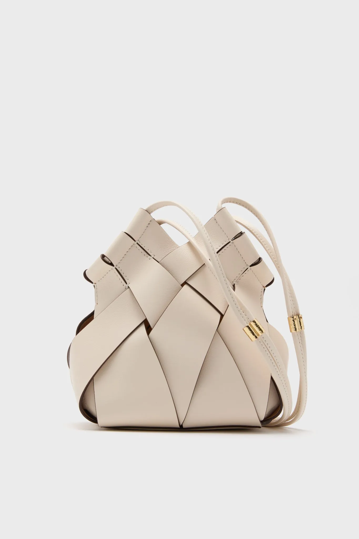 Cowrie Charlotte Woven Mini Bag sold by Tuckernuck