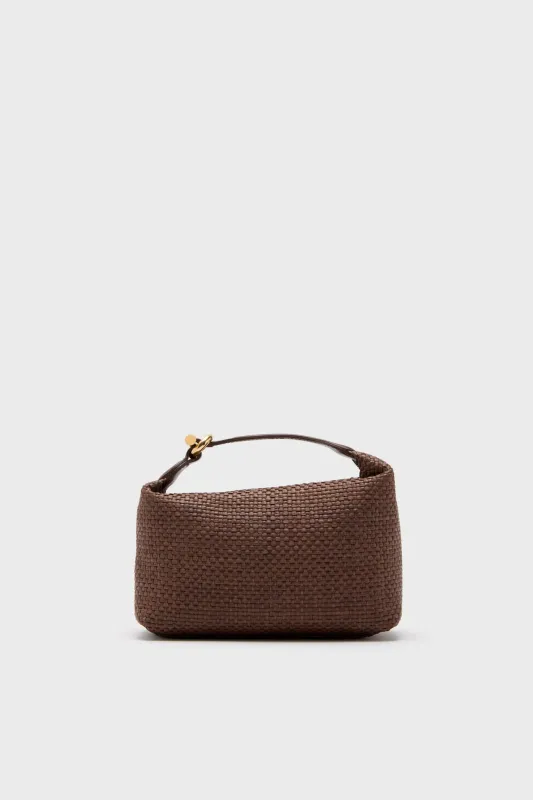 Caramel Raffia Micro Pillow Pouch sold by Tuckernuck