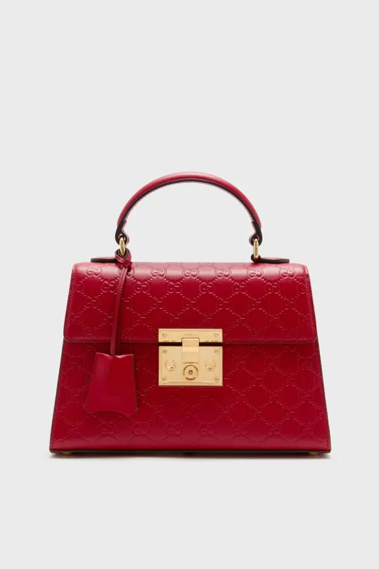 Gucci Red Padlock Guccissima Top Handle Bag sold by Tuckernuck