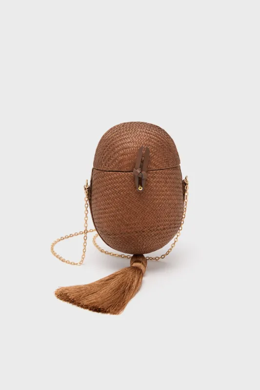 Brown Itza Clutch sold by Tuckernuck