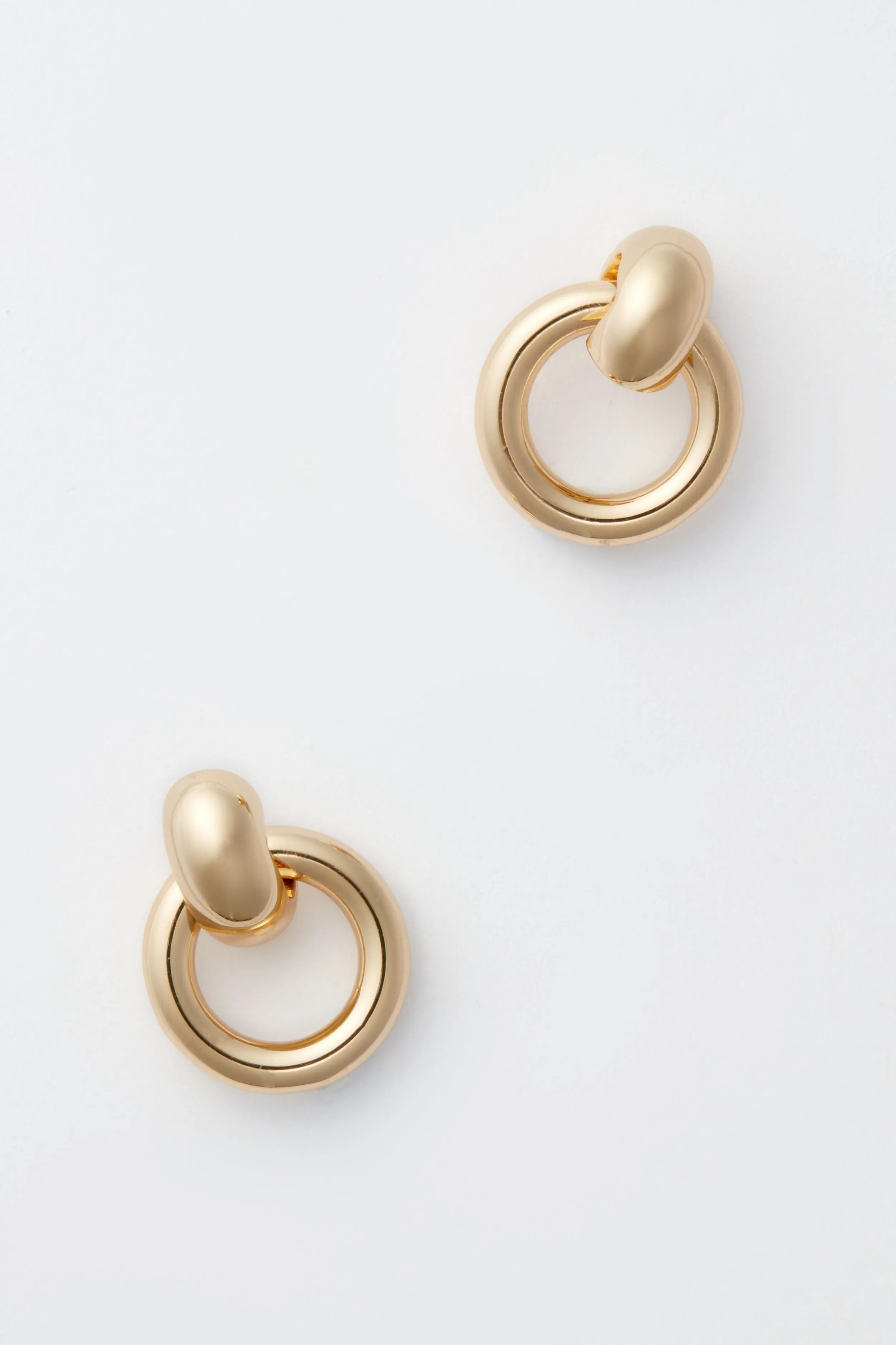 Gold Puffy Faye Knockers sold by Tuckernuck